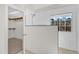 Modern bathroom with a window, tiled shower, and a door leading to the walk-in closet at 154 Ashton Ln, Angier, NC 27501