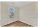 Cozy bedroom features wood floors and a bright window showcasing neighborhood views at 154 Ashton Ln, Angier, NC 27501