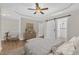 Bedroom featuring a decorative tray ceiling, barn door and modern decor at 154 Ashton Ln, Angier, NC 27501