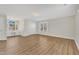 Spacious bedroom with hardwood floors, two large windows, and recessed lighting at 154 Ashton Ln, Angier, NC 27501