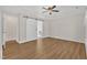 Spacious primary bedroom showcasing a decorative tray ceiling and barn door to ensuite at 154 Ashton Ln, Angier, NC 27501