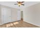 Bright bedroom with wood floors offers ample space, closet access, and abundant natural light at 154 Ashton Ln, Angier, NC 27501