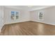 Bright bedroom with two large windows and hardwood floors and base molding at 154 Ashton Ln, Angier, NC 27501