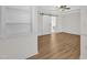 Large bedroom with wood floors and a sliding barn door leading to the bathroom at 154 Ashton Ln, Angier, NC 27501