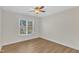 Bright bedroom featuring a window and a ceiling fan and hard wood flooring at 154 Ashton Ln, Angier, NC 27501