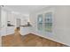 Charming dining area featuring hardwood floors and natural light streaming in from the nearby windows at 154 Ashton Ln, Angier, NC 27501