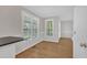 Bright dining area featuring plentiful natural light, hardwood floors, and direct access to the kitchen at 154 Ashton Ln, Angier, NC 27501