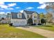 Attractive two-story home with a two-car garage and manicured front lawn at 154 Ashton Ln, Angier, NC 27501