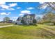 Inviting two-story home features a well-kept lawn, a two-car garage, and mature landscaping at 154 Ashton Ln, Angier, NC 27501
