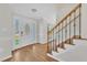 Bright foyer boasts hardwood floors, stairs, and an elegant front door at 154 Ashton Ln, Angier, NC 27501