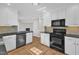 View of the open-concept kitchen featuring modern appliances and tile backsplash at 154 Ashton Ln, Angier, NC 27501