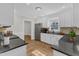 Bright kitchen with hardwood floors, stainless steel appliances and white cabinets at 154 Ashton Ln, Angier, NC 27501