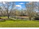 Scenic view of the lake surrounded by mature trees in the backyard at 154 Ashton Ln, Angier, NC 27501