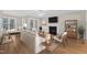 Cozy living room features a fireplace, neutral decor, and access to the outdoors at 154 Ashton Ln, Angier, NC 27501