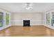 Bright living room features wood floors, a fireplace, and access to the patio at 154 Ashton Ln, Angier, NC 27501