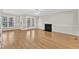 Spacious living room features wood floors, a fireplace, and natural light at 154 Ashton Ln, Angier, NC 27501