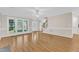 Bright living room featuring hardwood floors, large windows, and open floor plan, perfect for gatherings at 154 Ashton Ln, Angier, NC 27501