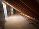 Unfinished attic space provides potential for extra storage or customizable living space at 163 Noramac Ct, Selma, NC 27576
