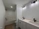 Modern bathroom featuring a double sink vanity and a shower-tub combo for complete functionality at 163 Noramac Ct, Selma, NC 27576