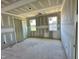 Unfinished bedroom with two windows and closet space at 163 Noramac Ct, Selma, NC 27576