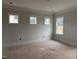 Bedroom with multiple windows allowing lots of natural light at 163 Noramac Ct, Selma, NC 27576
