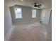 Spacious bedroom with two windows and a ceiling fan provides ample natural light and comfort at 163 Noramac Ct, Selma, NC 27576