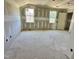 Unfinished bedroom with multiple windows at 163 Noramac Ct, Selma, NC 27576