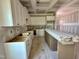 Unfinished kitchen features white cabinets, an island, and lots of space for customization at 163 Noramac Ct, Selma, NC 27576