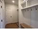 Functional mudroom with a bench, hooks, and a closet for storage at 163 Noramac Ct, Selma, NC 27576