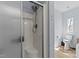 Tiled shower in a bathroom with a toilet, window, and neutral color scheme at 170 Buckaroo Dr, Louisburg, NC 27549