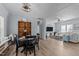 Open dining area with wood floors is adjacent to the living area with a decorative cabinet for storage at 170 Buckaroo Dr, Louisburg, NC 27549