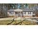 Charming single-story home features a ramp entrance, covered porch, and a well-maintained front yard at 170 Buckaroo Dr, Louisburg, NC 27549