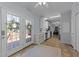 Kitchen featuring white cabinets and breakfast area leading to an outdoor deck at 170 Buckaroo Dr, Louisburg, NC 27549