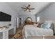 Comfortable main bedroom featuring a ceiling fan, vanity, and light blue walls at 170 Buckaroo Dr, Louisburg, NC 27549