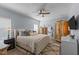 Comfortable main bedroom with a ceiling fan, ensuite bathroom, and large wardrobe, creating a relaxing retreat at 170 Buckaroo Dr, Louisburg, NC 27549