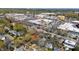 Aerial view showcases a vibrant neighborhood near downtown, surrounded by lush trees and convenient amenities at 1714 Park Dr, Raleigh, NC 27605