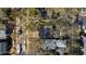 Overhead view capturing houses nestled among mature trees on neighborhood streets, with visible parking areas at 1714 Park Dr, Raleigh, NC 27605