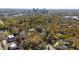 Expansive aerial view of a vibrant city neighborhood featuring tree-lined streets and diverse architecture at 1714 Park Dr, Raleigh, NC 27605