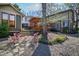 Charming backyard with stone accents and red outdoor seating provides an inviting and stylish outdoor living space at 1714 Park Dr, Raleigh, NC 27605