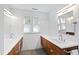 Bright bathroom featuring double sinks, modern fixtures, and natural light at 1714 Park Dr, Raleigh, NC 27605