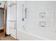 Bright bathroom featuring a white subway-tiled shower and tub combination, complete with modern fixtures at 1714 Park Dr, Raleigh, NC 27605