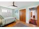 Bedroom with hardwood floors, a ceiling fan, and doorway leading to another part of the home at 1714 Park Dr, Raleigh, NC 27605