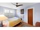 Serene bedroom featuring hardwood floors, ceiling fan, and art pieces, offering a cozy retreat at 1714 Park Dr, Raleigh, NC 27605