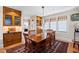 Elegant dining room with hardwood floors, stylish lighting, and built in cabinets at 1714 Park Dr, Raleigh, NC 27605