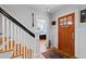 Bright foyer showcasing a staircase, wooden front door, and hardwood floors at 1714 Park Dr, Raleigh, NC 27605