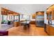 Open kitchen featuring a large island, stainless steel appliances, and hardwood floors at 1714 Park Dr, Raleigh, NC 27605