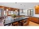 Bright kitchen featuring an island with seating, stainless steel appliances, and folding doors to the sunroom at 1714 Park Dr, Raleigh, NC 27605