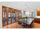 Bright kitchen featuring an island with seating, wood cabinets, and folding doors to the sunroom at 1714 Park Dr, Raleigh, NC 27605
