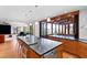 Spacious kitchen featuring an island with seating and stainless steel appliances, with a view to living space at 1714 Park Dr, Raleigh, NC 27605