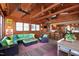 Open living room flows into the kitchen, featuring wood ceiling, and comfortable seating at 1714 Park Dr, Raleigh, NC 27605